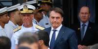 O presidente Jair Bolsonaro durante evento no 1º Distrito Naval, no Rio, onde almoçou com almirantes  Foto: Fernando Frazão/Agência Brasil / Estadão Conteúdo