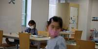 Crianças com máscara de proteção em escola de Tóquio
05/03/2020
REUTERS/Stoyan Nenov  Foto: Reuters