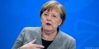 Merkel em entrevista coletiva após reunião com governadores para discutir a pandemia de coronavírus  Foto: DW / Deutsche Welle