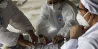 Funcionários de saúde conduzem testes de Covid-19 no Rio de Janeiro
15/06/2020 REUTERS/Ricardo Moraes  Foto: Reuters