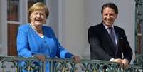 Merkel e o premiê Conte. Pacote enfrenta resistência de países mais “frugais” da UE  Foto: DW / Deutsche Welle