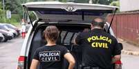Agentes da Polícia Civil durante operação  Foto: Sinpol / DF / Agência Brasil / Estadão