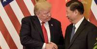 Donald Trump, retratado aqui ao lado do presidente Xi Jinping, apresenta a China como uma ameaça aos EUA  Foto: Getty Images / BBC News Brasil