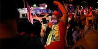 Eleitores republicanos comemoram vitória de Trump em Little Havana, na Flórida  Foto: Reuters / BBC News Brasil