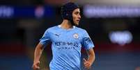 Eric em ação com a camisa do Manchester City (Foto: MIKE EGERTON / POOL / AFP)  Foto: Lance!