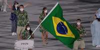 Ketleyn Quadros e Bruninho foram os porta-bandeiras do Brasil  Foto:  Julio Cesar Guimarães/COB