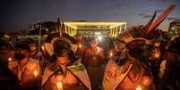 Indígenas protestam em Brasília para manter direitos sobre suas terras  Foto: EPA / Ansa