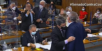 Renan Calheiros e Jorginho Mello discutem em sessão da CPI  Foto: TV Senado / Reprodução
