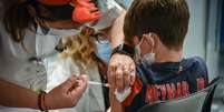 Vacinação de crianças em postos de saúde da Itália  Foto: ANSA / Ansa - Brasil