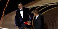 Will Smith deu um tapa no rosto de Chris Rock durante o Oscar  Foto: AFP / Ansa - Brasil