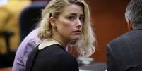 Amber Heard no tribunal  Foto: Getty Images / BBC News Brasil