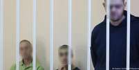Aiden Aslin, Shaun Pinner e Brahim Saadoun no tribunal de Donetsk  Foto: DW / Deutsche Welle