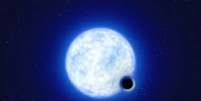 Ilustração de buraco negro na órbita de uma companheira jovem, massiva e quente (Imagem: Reprodução/ESO/L. Calçada)  Foto: Canaltech