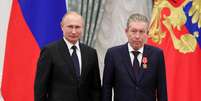 Ravil Maganov com Putin  Foto: Reuters