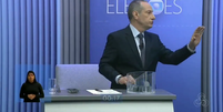 O jornalista lembrou o candidato que ele estava infringindo as regras do debate  Foto: Reprodução/ TV Globo