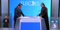 O presidente e candidato à reeleição, Jair Bolsonaro (PL), e Padre Kelmon (PTB) fizeram 'dobradinha' em mais um debate para atacar Lula e esquerda  Foto: Reprodução/TV Globo