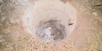 Cisterna onde mais três corpos foram encontrados em Planaltina (Reprodução - TV Globo)  Foto: Reprodução: TV Globo