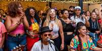 Imagem mostra pessoas negras curtindo um show de samba no Galpão ZN.  Foto: Divulgação / Alma Preta