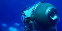 Foto antiga do submarino Titan, próximo a plataforma de onde foi liberado  Foto: OCEANGATE EXPEDITIONS/PA WIRE / BBC News Brasil