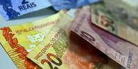 Quase 63% dos beneficiários têm direito a receber até R$ 10  Foto: Agência Brasil 