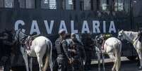 Movimentação de policiais militares no distrito de Vicente de Carvalho, no Guarujá  Foto: TABA BENEDICTO/ESTADÃO / Estadão