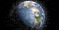 Vista espacial de satélites orbitando em volta da Terra   Foto: NASA JSC / BBC News Brasil