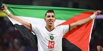 Na última Copa, jogadores de Marrocos exibiram bandeiras da Palestina  Foto: Matthias Hangst/Getty Images