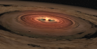 A anã marrom chamada OTS 44, tem apenas 15 vezes o tamanho de Júpiter, o que a torna a menor anã marrom conhecida por hospedar um disco protoplanetário ou formador de planetas.  Foto:  NASA/JPL-Caltech  / Tecmundo
