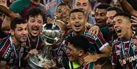 Fluminense conquista o t&iacute;tulo in&eacute;dito da Libertadores   Foto: PABLO PORCIUNCULA/AFP via Getty Images / Esporte News Mundo