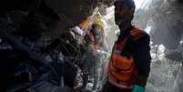 Grande parte da Faixa de Gaza foi reduzida a escombros por ataques aéreos israelenses  Foto: Getty Images / BBC News Brasil