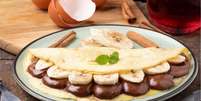 Crepioca recheada com banana e chocolate  Foto: RoYam | Shutterstock / Portal EdiCase