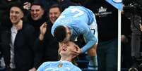 Foden e Haaland maracaram os gols da virada do City -   Foto: PAUL ELLIS/AFP via Getty Images / Esporte News Mundo