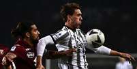  Foto: Marco Bertorello/AFP via Getty Images - Legenda: Vlahovic comemora gol marcado pela Juventus / Jogada10
