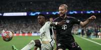 Thomas Coex/AFP via Getty Images - Legenda: Vini Jr foi o grande nome da classificação do Real Madrid sobre o Bayern - Foto: Thomas Coex/AFP via Getty Images / Jogada10
