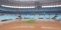 Foto: Reprodução / Radio GreNal - Legenda: Arena do Grêmio ficou submersa com as enchentes no Sul do país / Jogada10
