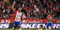 Manaure Quintero/AFP via Getty Images - Legenda: Dovbyk comemora um dos três gols marcados na goleada do Girona -  Foto: Manaure Quintero/AFP via Getty Images / Jogada10