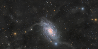 Galáxia NGC 2403, encontrada a 10 milhões de anos-luz (Imagem: Reprodução/(Team F.A.C.T.) Lilian Lbt - Cyrille Malo - Maxime Martin - Clément Daniel - Paul Grasset - Louis Leroux-Géré)  Foto: Canaltech