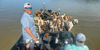 EUA: pescadores viram heróis ao resgatarem 38 cães de afogamento em lago no Mississippi   Foto: Reprodução