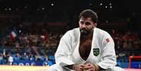 Arena Champ de Mars, Paris, França - 31 de julho de 2024. Rafael Macedo do Brasil reage após perder luta contra Maxime-Gael Ngayap Hambou da França  Foto: Reuters/Arlette Bashizi