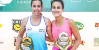 Vitória Marchezini de rosa e Goldman de branco e azul Foto: Momentum / Esporte News Mundo