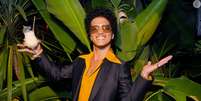 Bruno Mars no Brasil: você sabia que o cantor quase cancelou um show aqui depois de se acabar na feijoada e caipirinha?.  Foto: Getty Images / Purepeople