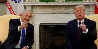 Primeiro-ministro de Israel, Benjamin Netanyahu, ao lado do então presidente dos EUA, Donald Trump, na Casa Branca em 2020  Foto: REUTERS/Tom Brenner