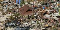 Em 28 de dezembro de 2004, equipes de resgate vasculhavam área devastada na Tailândia  Foto: Paula Bronstein/Getty Image / BBC News Brasil