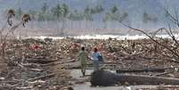 O tsunami deixou apenas destruição e mortenova casa de apostasseu rastro  Foto: Getty Images / BBC News Brasil