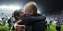 Guardiola e Cristina Serra celebram título da Liga dos Campeões Foto: NurPhoto/Getty Images