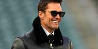 Ex-jogador de futebol americano Tom Brady sorri  Foto: Mitchell Leff  / Getty Images