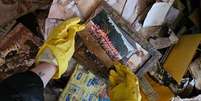 Fotografia encontrada em uma casa destruída pelas enchentes na cidade gaúcha de Sinimbu  Foto: DW / Deutsche Welle