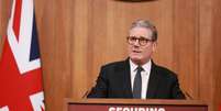 O primeiro-ministro da Grã-Bretanha, Keir Starmer, durante uma coletiva de imprensa sobre migração, em Londres, em 12 de maio de 2025.  Foto: via REUTERS - Ian Vogler / RFI