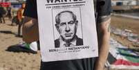Cartaz mostra o rosto do premiê israelense em manifestação pró-Gaza  Foto: ANSA / Ansa - Brasil