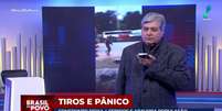 Datena apresenta parte do 'Brasil do Povo' ao celular em contato ao vivo com suas fontes na polícia  Foto: Reprodução/TV
